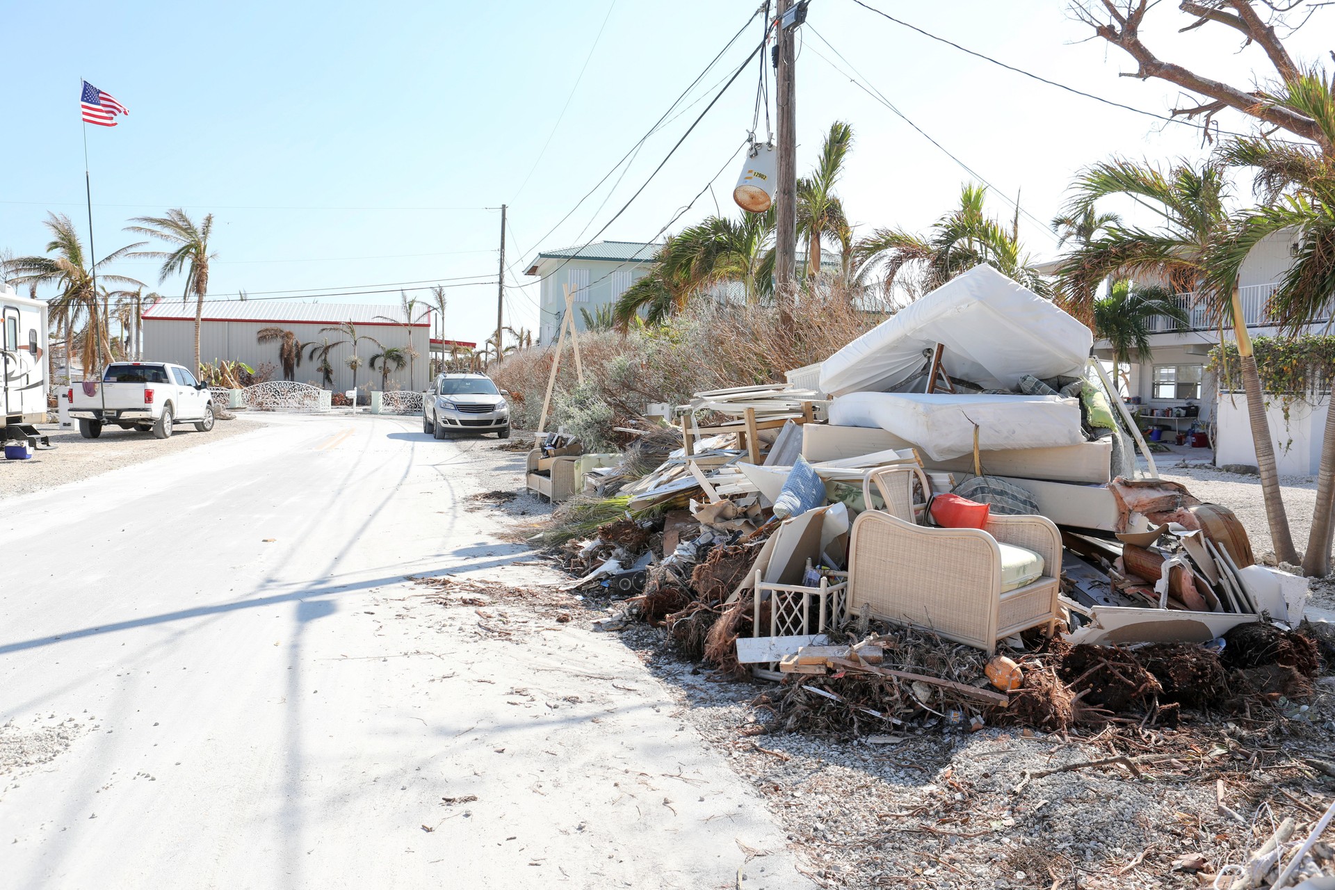 Piles of trash and and furniture destroyed by flooding caused by hurricane.